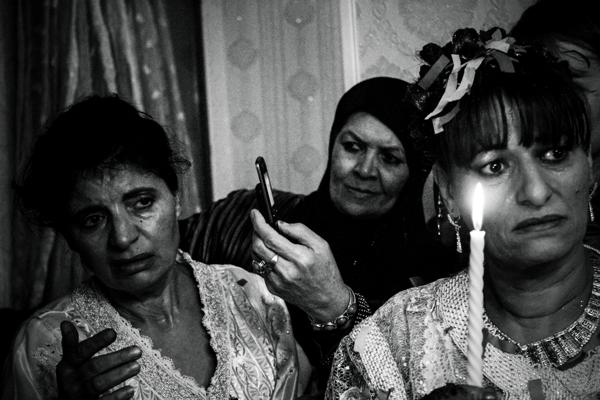 Bride's mother surrounded by relatives. Her 19-years-old daughter will leave the family house less than a year after. Meanwhile, she will receive gifts -"shoura"- all along the engagement period until the wedding day. This moment is emotional, both sad and joyful because it marks the end of childhood.